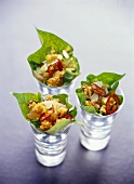 Deep-fried fish fillets in lettuce leaf, served in glasses