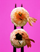 Two nigiri-sushi with shrimps and lumpfish roe