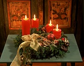 Advent flower arrangement with burning candles