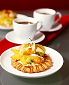 Exotic fruit tart and two cups of coffee
