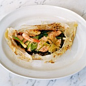 Fish and shrimps baked in paper