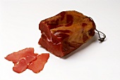 Wild boar ham, a piece and two slices