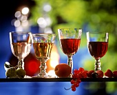 Four home-made liqueurs in glasses