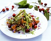 Summer salad with asparagus, flowers, chanterelles & cherries