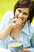 Woman eating cornflakes