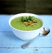 Herb soup with watercress and smoked fish
