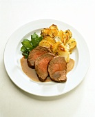 Beef fillet with potato gratin and mangetouts