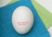 White free-range egg with stamp