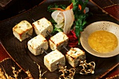 Paneer tikka (Pieces of cheese on skewer with tomato & herb dip)