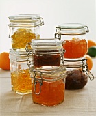 Several preserving jars with clips, with fruit jellies