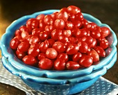 Fresh cranberries in turquoise ceramic bowl