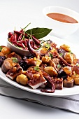 Squid ragout with chestnuts and onions