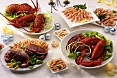 Several platters of cooked shellfish