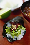 Maguro temaki (tuna, lettuce, rice and sesame in nori sheet)