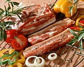 Belly pork on grill rack, vegetables beside it