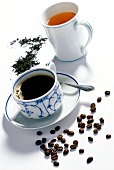 Cup of coffee and mug of black tea