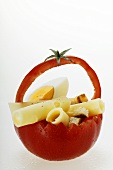 Tomato basket with cheese rolls, croutons and egg