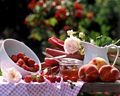 Peaches, strawberries and rhubarb on a garden table