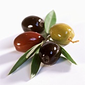 Four olives with leaves