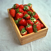 Fresh strawberries in wooden box