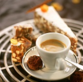 A cup of espresso with chocolate biscuit & spice cake