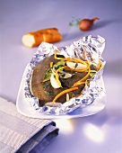 Plaice grilled in foil with strips of carrot