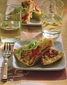 Potato tortilla with bacon, peppers and leeks