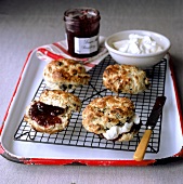 Scones with raisins; strawberry jam; clotted cream