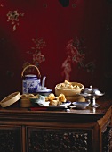 Chinese table scene with dim sum and tea