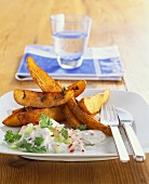Potato wedges with radishes and chervil in sour cream