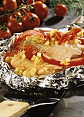 Salmon fillet steamed in foil with vegetables