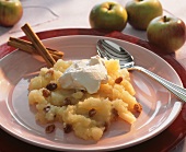 Apple compote with raisins, cinnamon and whipped cream