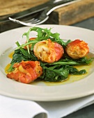Scallops wrapped in bacon with spinach