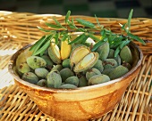 Freshly harvested green almonds in a bowl