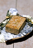 A vegetable stock cube in foil