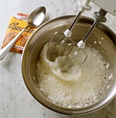 Beating egg white stiffly with baking powder