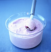 Raspberry ice cream in a small bowl
