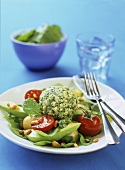 Chicken and herb meatballs on avocado salad