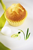 Muffin on plate with snowdrop motif