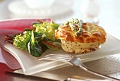 Small cheese and nut soufflé on salad