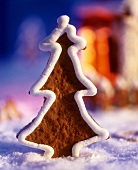 A fir tree-shaped gingerbread biscuit