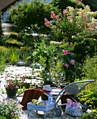 Lounger on idyllic terrace by garden pond