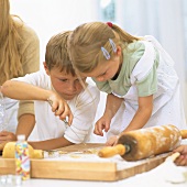 Children baking biscuits
