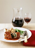 Beef roulade with spinach filling in red wine sauce