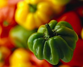 Peppers, a green one in foreground