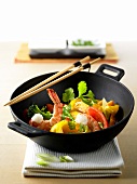 Wok-cooked dish with shrimps and vegetables