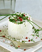 Fresh French goat's cheese with herbs and red pepper