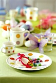 Colourful Easter table with chocolate beans