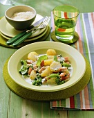 Potatoes in cream with peas and diced ham