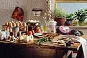 Rustic German kitchen table with ingredients and a roast